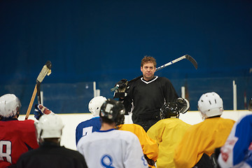 Image showing ice hockey players team meeting with trainer