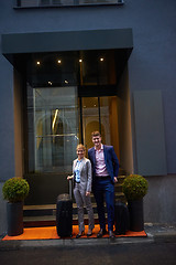 Image showing business people couple entering  hotel