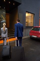 Image showing business people couple entering  hotel