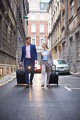 Image showing business people couple entering  hotel