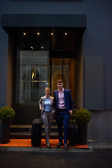 Image showing business people couple entering  hotel