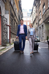 Image showing business people couple entering  hotel