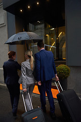 Image showing business people couple entering  hotel