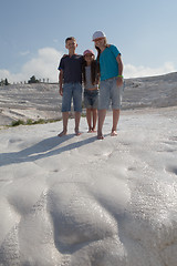 Image showing Three children on background of limestone of Pamukkale, Turkey