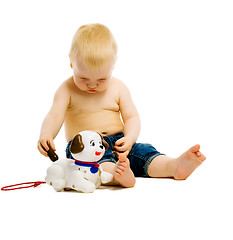 Image showing Baby boy playing with toys. isolated