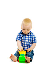 Image showing Baby boy playing with toys. isolated