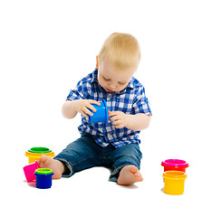 Image showing Baby boy playing with toys. isolated