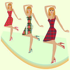 Image showing Fashion models posing on podium in various checkered dresses