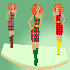 Image showing Fashion models posing on podium in different checkered dresses