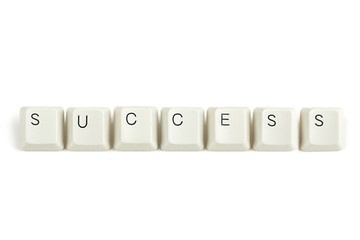 Image showing success from scattered keyboard keys on white