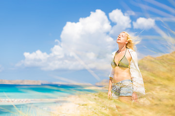 Image showing Free Happy Woman Enjoying Sun on Vacations.