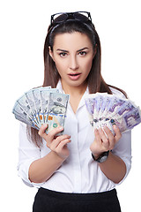 Image showing Business woman holding British pounds and US dollars