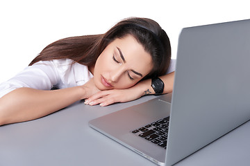 Image showing Businesswoman asleep on her laptop