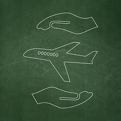 Image showing Insurance concept: Airplane And Palm on chalkboard background