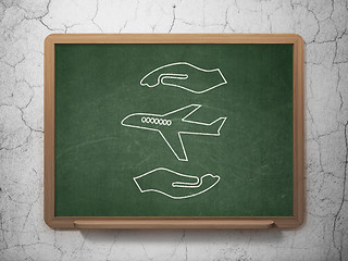 Image showing Insurance concept: Airplane And Palm on chalkboard background