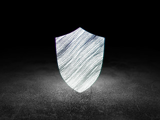 Image showing Security concept: Shield in grunge dark room