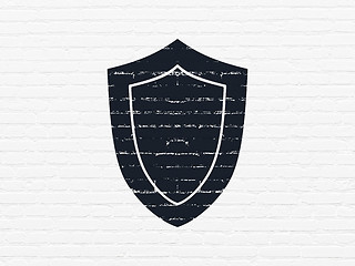 Image showing Protection concept: Shield on wall background