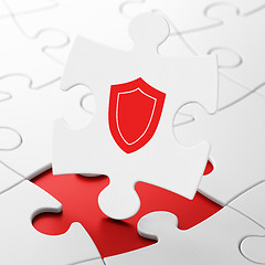 Image showing Privacy concept: Shield on puzzle background