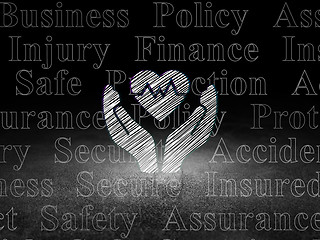 Image showing Insurance concept: Heart And Palm in grunge dark room