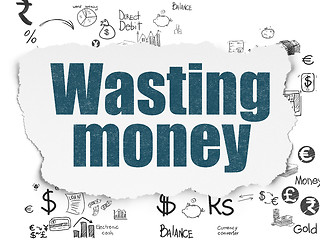 Image showing Currency concept: Wasting Money on Torn Paper background