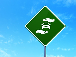 Image showing Insurance concept: Car And Palm on road sign background