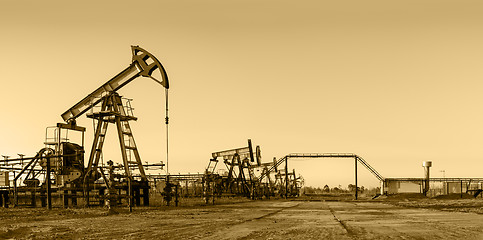 Image showing Oil pumps on a oil field.