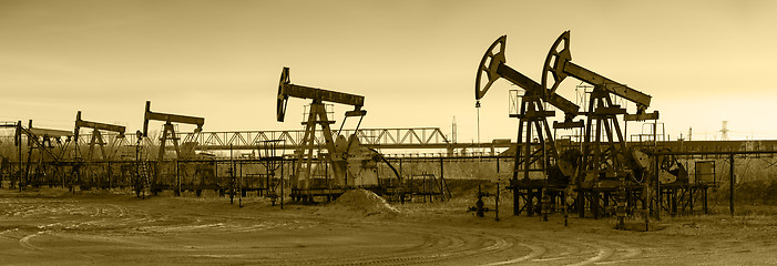 Image showing Oil pumps on a oil field.