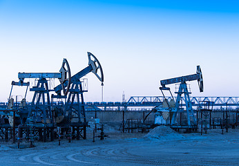Image showing Oil pumps on a oil field.