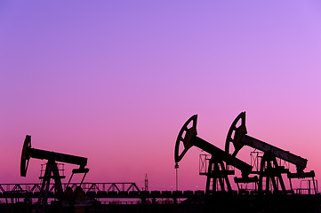 Image showing Oil pumps on a oil field.