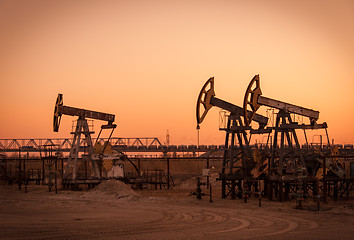 Image showing Oil pumps on a oil field.