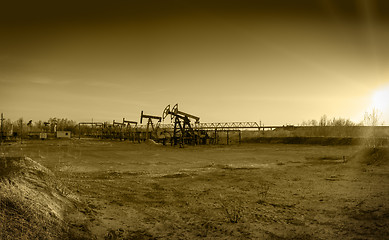 Image showing Oil pumps on a oil field.