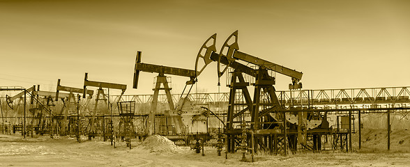 Image showing Oil pumps on a oil field.