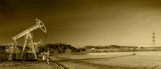 Image showing Oil pumps on a oil field.