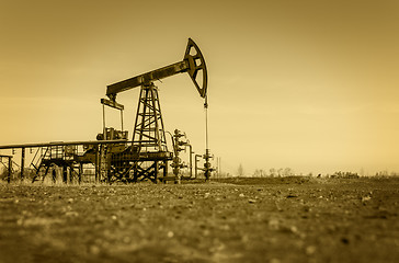 Image showing Oil pump on a oil field.