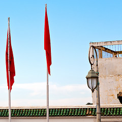 Image showing tunisia  waving flag in the blue sky  colour and battlements  wa