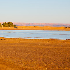 Image showing sunshine in the lake yellow  desert of morocco sand and     dune