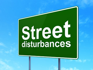 Image showing Politics concept: Street Disturbances on road sign background