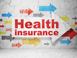 Image showing Insurance concept: arrow with Health Insurance on grunge wall background