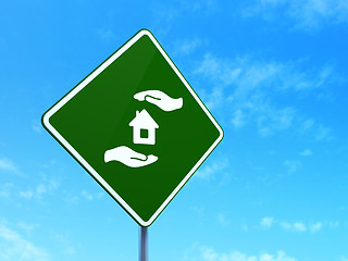 Image showing Insurance concept: House And Palm on road sign background