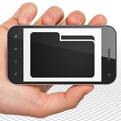 Image showing Business concept: Hand Holding Smartphone with Folder on display