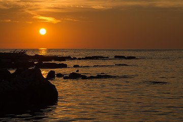 Image showing gorgeous sunset on the rocky coast of Adriatic