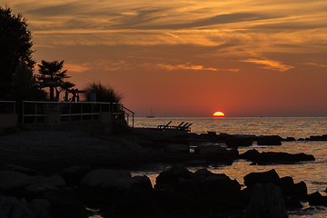 Image showing gorgeous sunset on the rocky coast of Adriatic