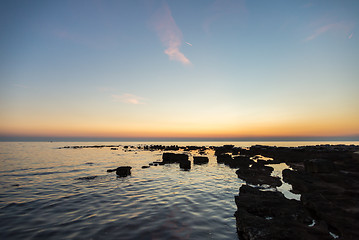 Image showing gorgeous sunset on the rocky coast of Adriatic