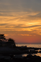 Image showing gorgeous sunset on the rocky coast of Adriatic