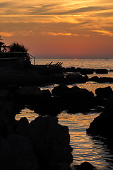 Image showing gorgeous sunset on the rocky coast of Adriatic