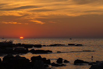 Image showing gorgeous sunset on the rocky coast of Adriatic
