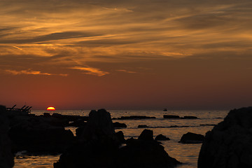 Image showing gorgeous sunset on the rocky coast of Adriatic