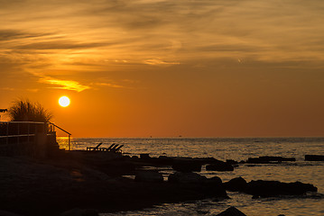 Image showing gorgeous sunset on the rocky coast of Adriatic