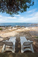 Image showing loungers on the rocky beaches