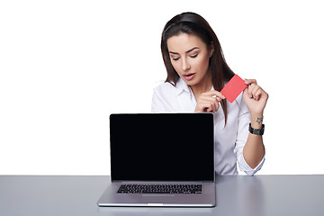 Image showing Business woman with laptop showing credit card